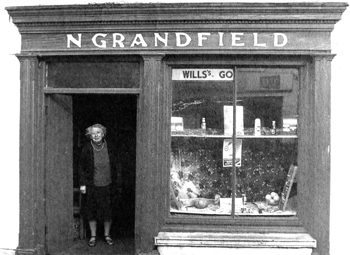 Nell outside her shope